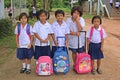 Five girls stand to line on road.